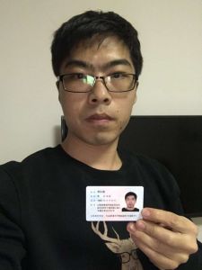 A picture of him holding his driver's license for the camera like the retard he is.